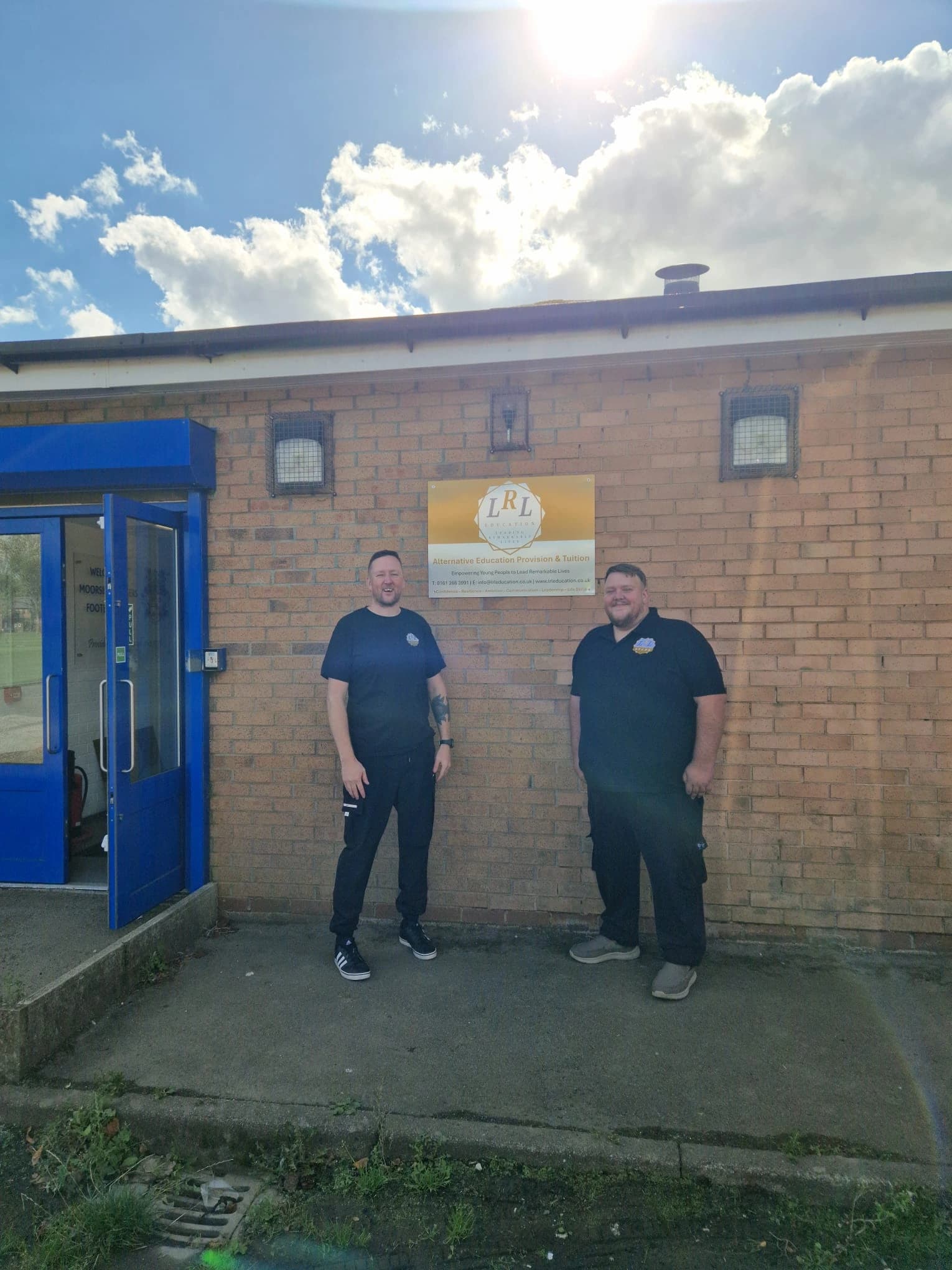 Two LRL Education staff members outside the Salford provision.